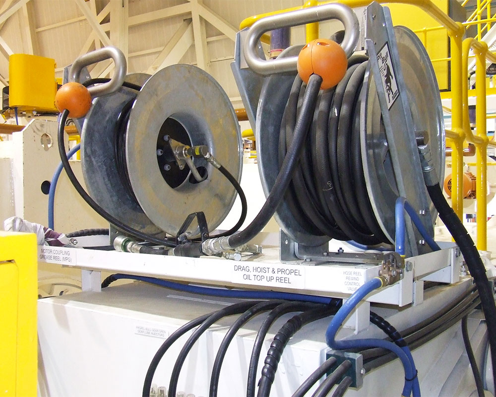 Mining Hose Reels- Pit Bull air rewind hose reels for oil and grease services on drag line.